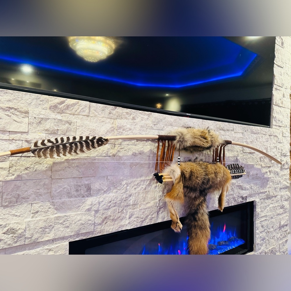 Hand made bow and arrow by enrolled member of the Cherokee tribe. 68”